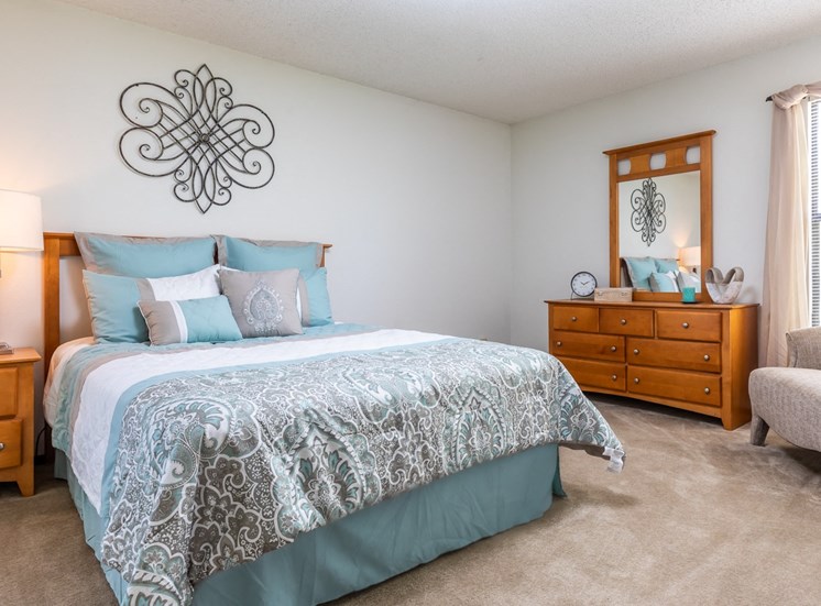 Bedroom with wooden dressing at Cloverset Valley Apartments, Kansas City