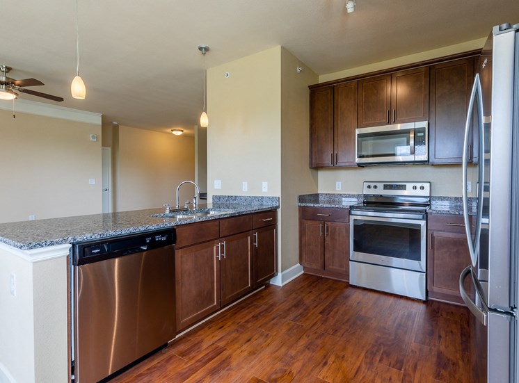Kitchen With Custom Cabinetry at The Residences at Bluhawk Apartments, Overland Park, KS