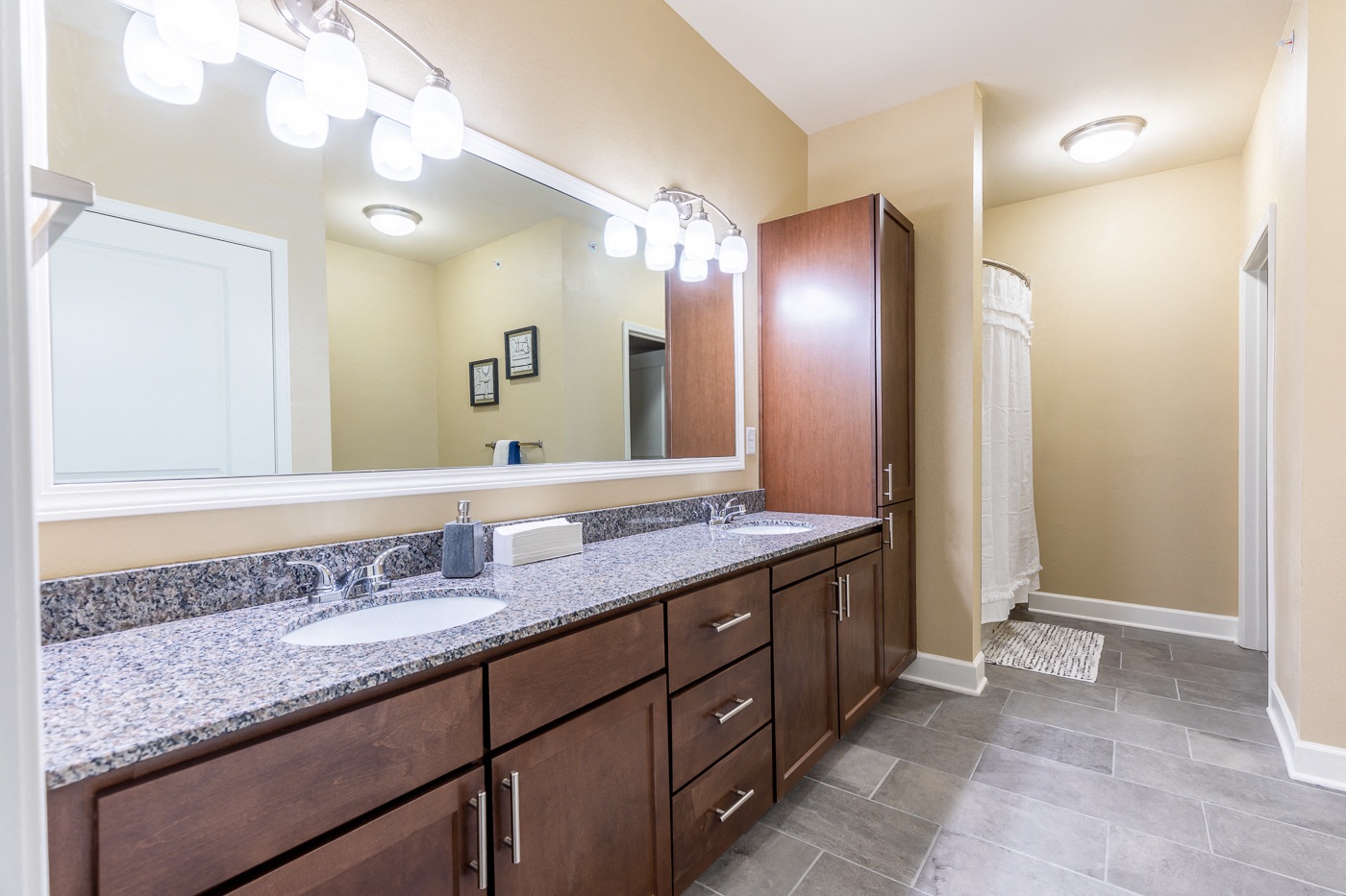 Bathroom With Vanity Lights at The Residences at Bluhawk Apartments, Overland Park