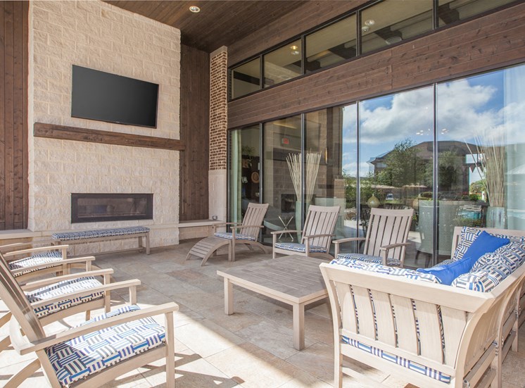 outdoor living area with chairs and tv