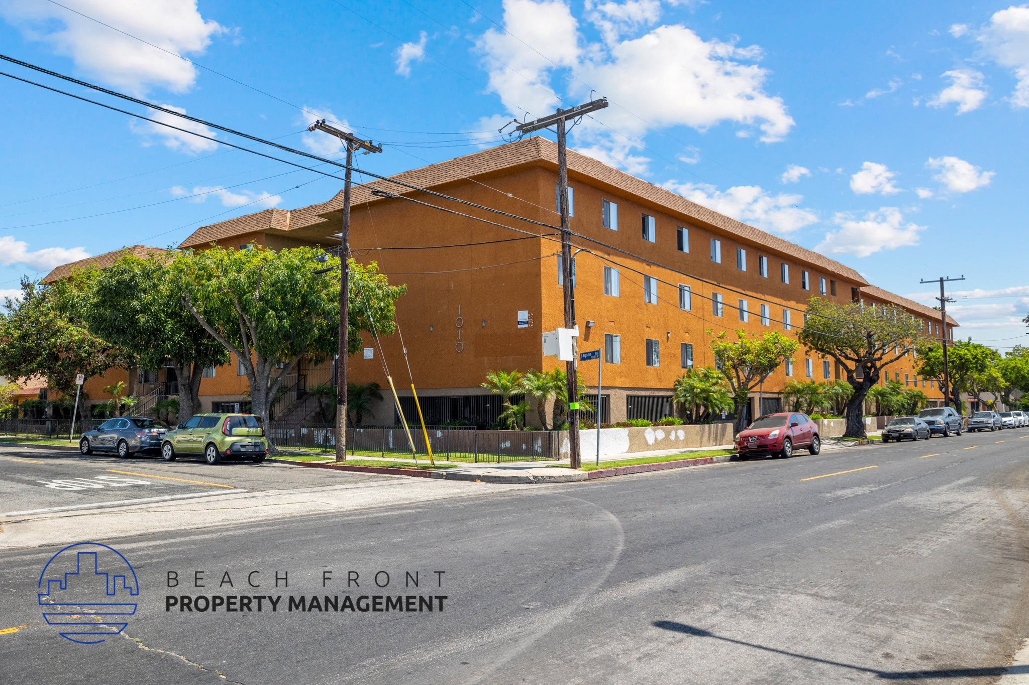 A building with the words Beach Front Property Management on the bottom left corner.