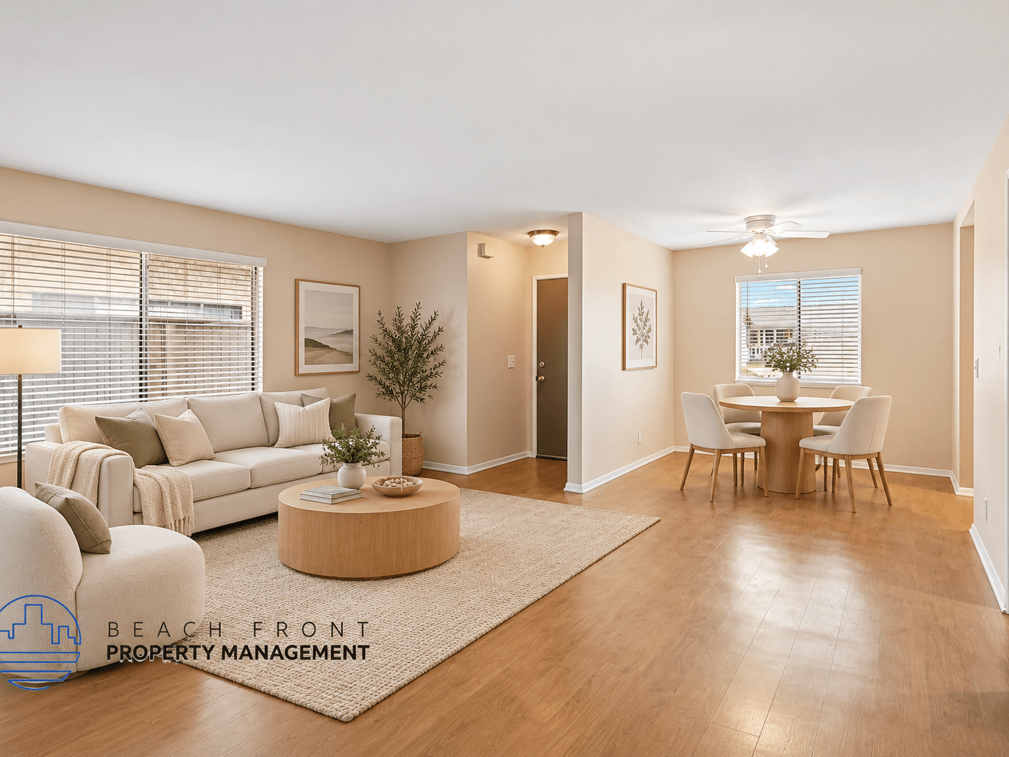 A living room with a couch, a coffee table, a dining table, and chairs.