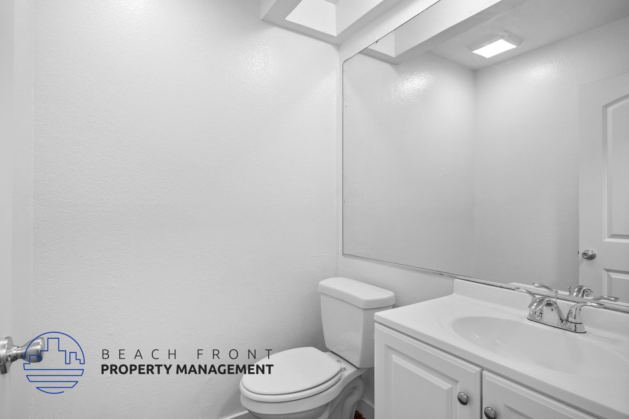a bathroom with a toilet and a sink and a mirror,a bathroom with a toilet and a sink and a mirror