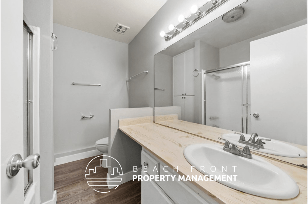 a bathroom with a sink and a mirror and a shower