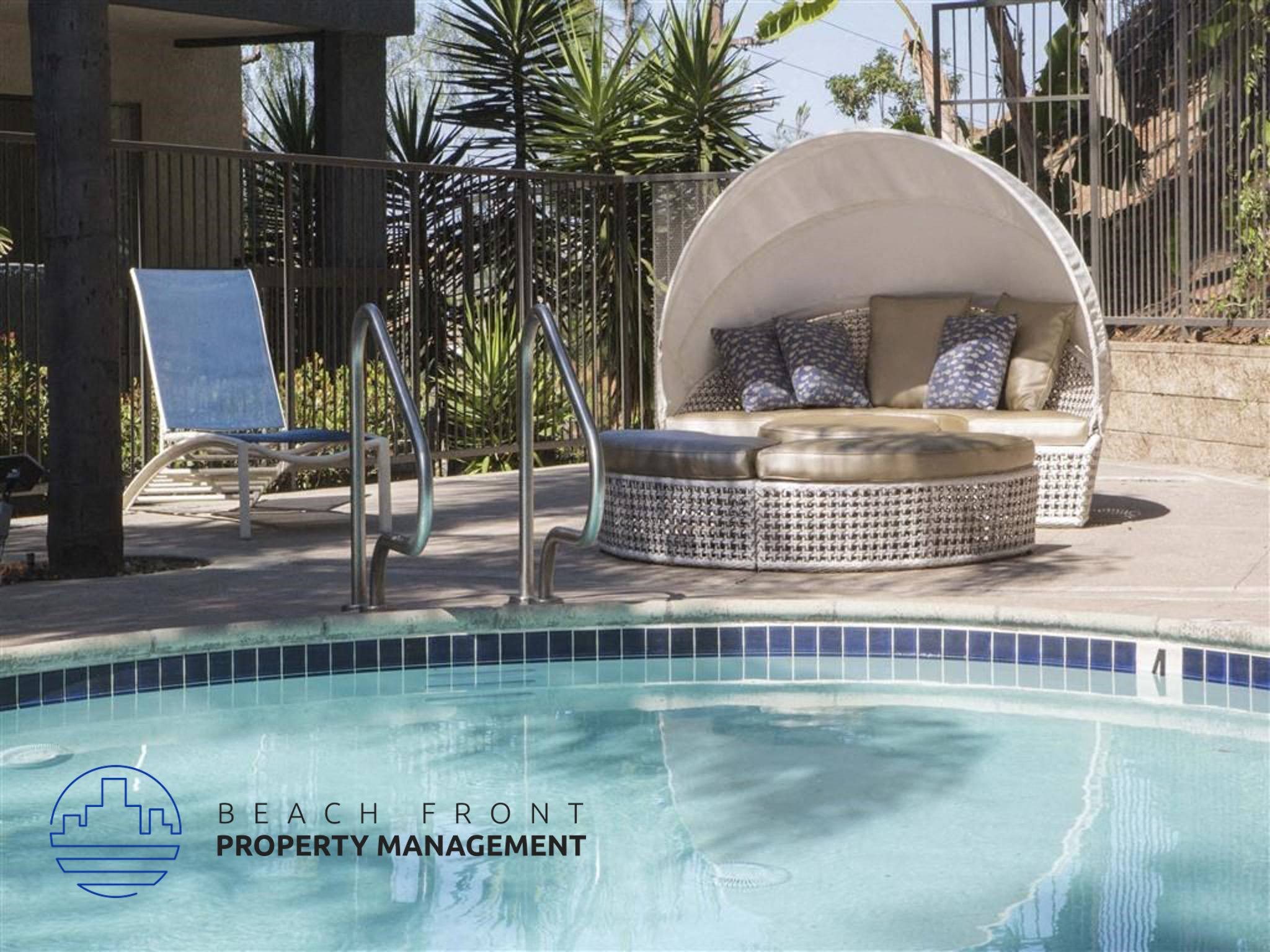 a round lounge chair next to a swimming pool