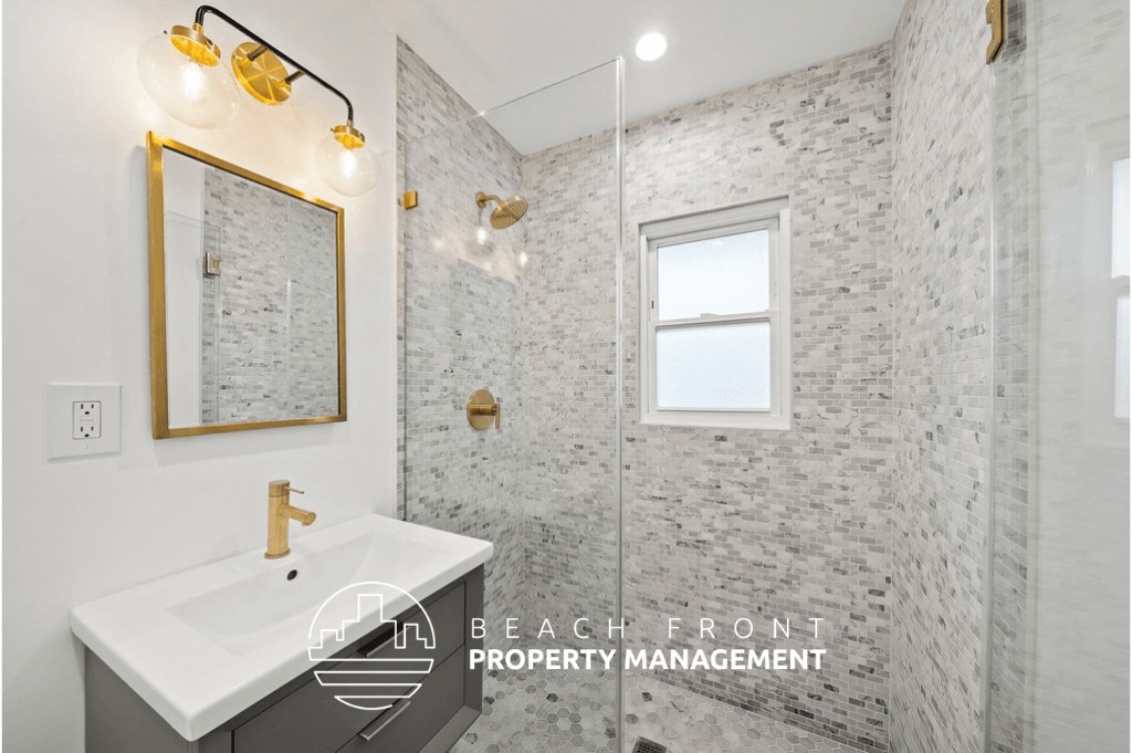a bathroom with a sink and a shower and a mirror