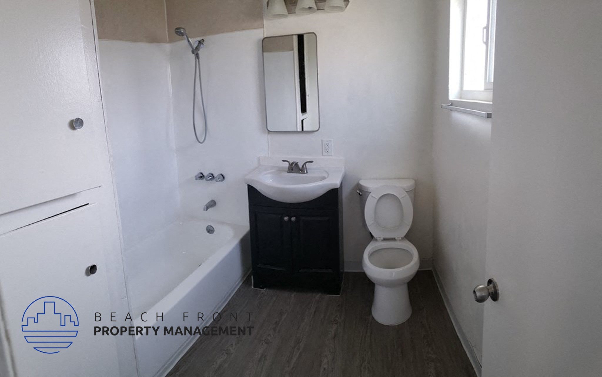 a bathroom with a toilet and a sink and a bath tub