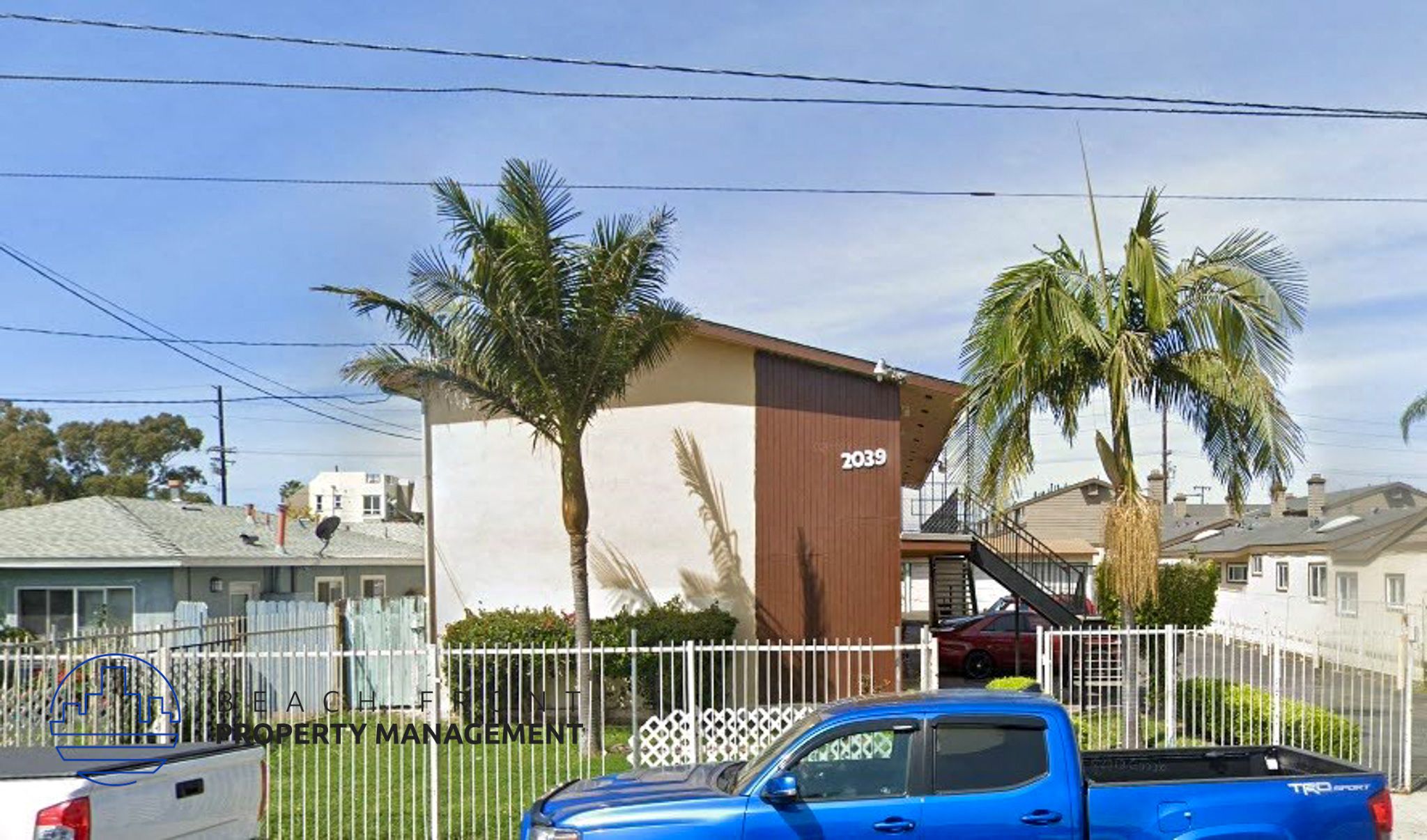 a house with palm trees in front of it