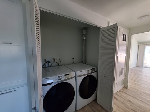 a laundry room with a washer and a dryer in it
