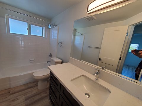 an empty bathroom with a sink and a toilet