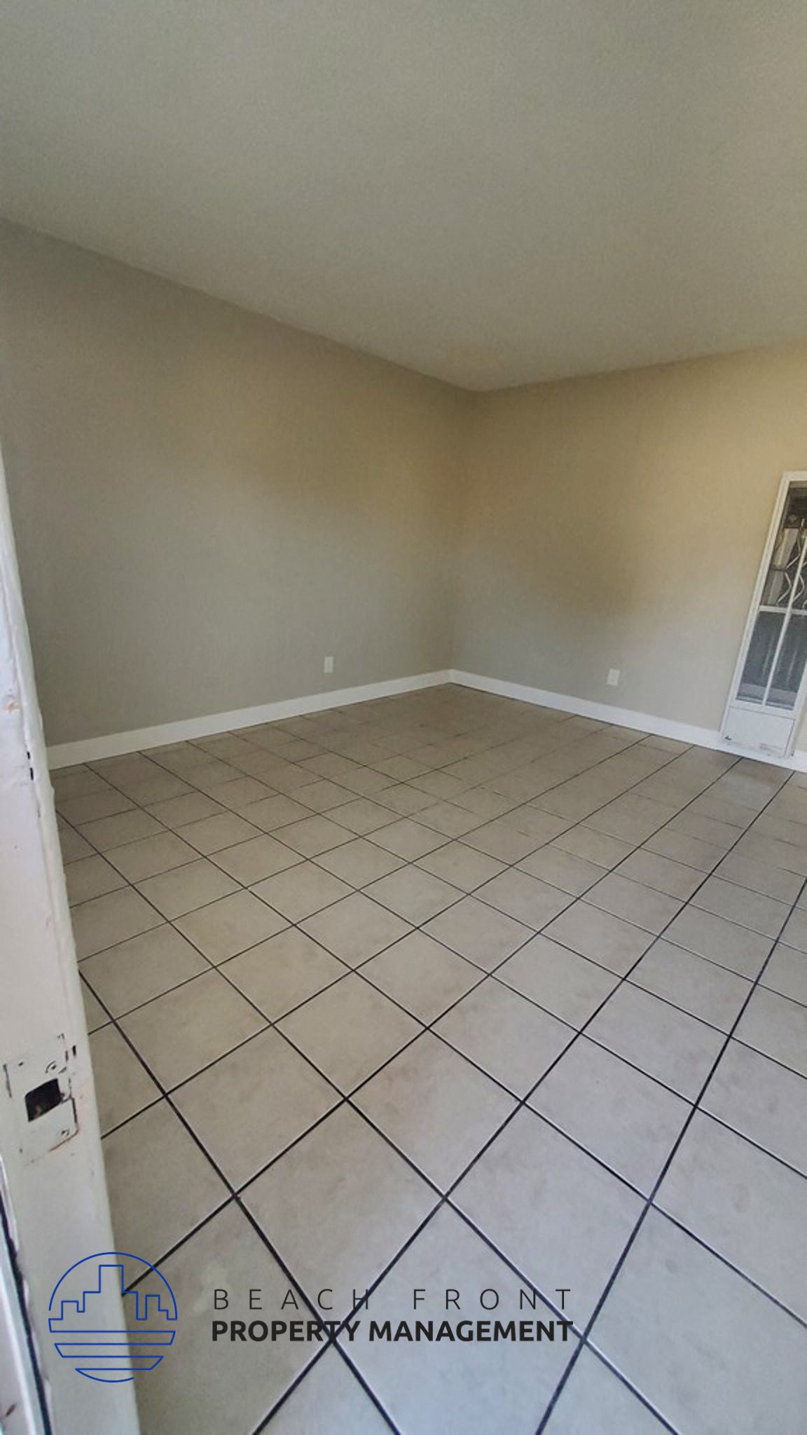 an empty room with a tiled floor