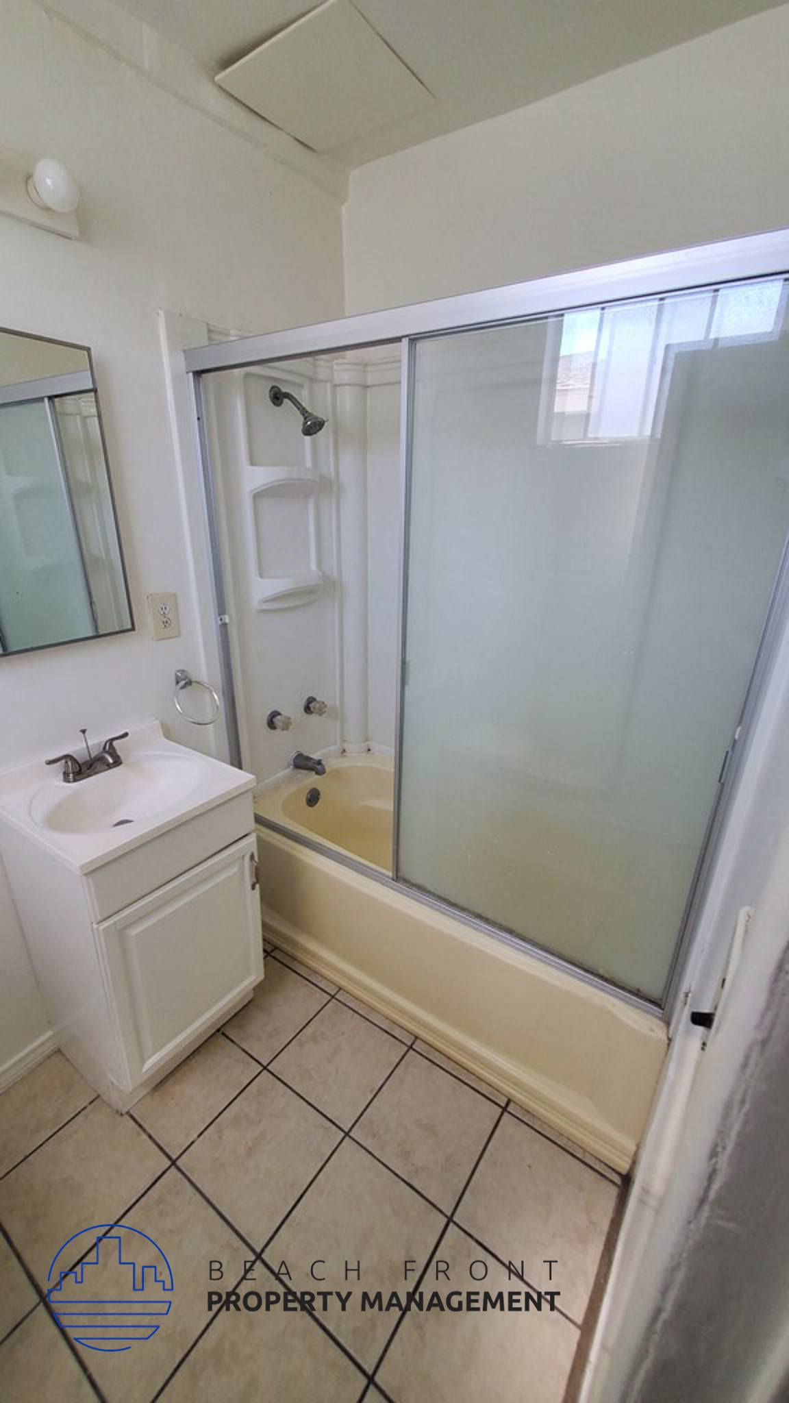 a bathroom with a sink and a shower