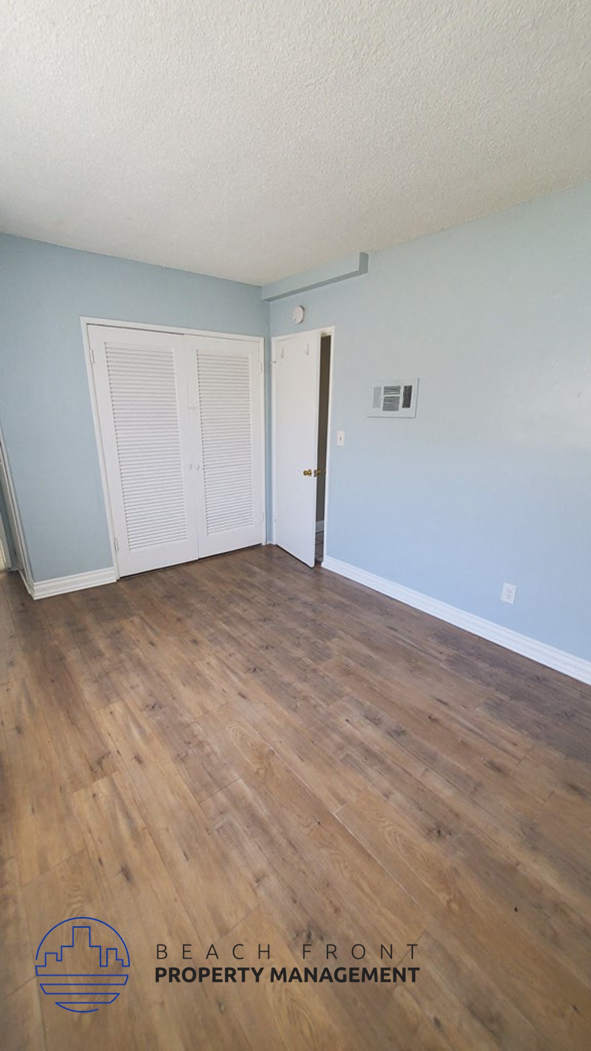 a view of the floor of a room with wooden floors