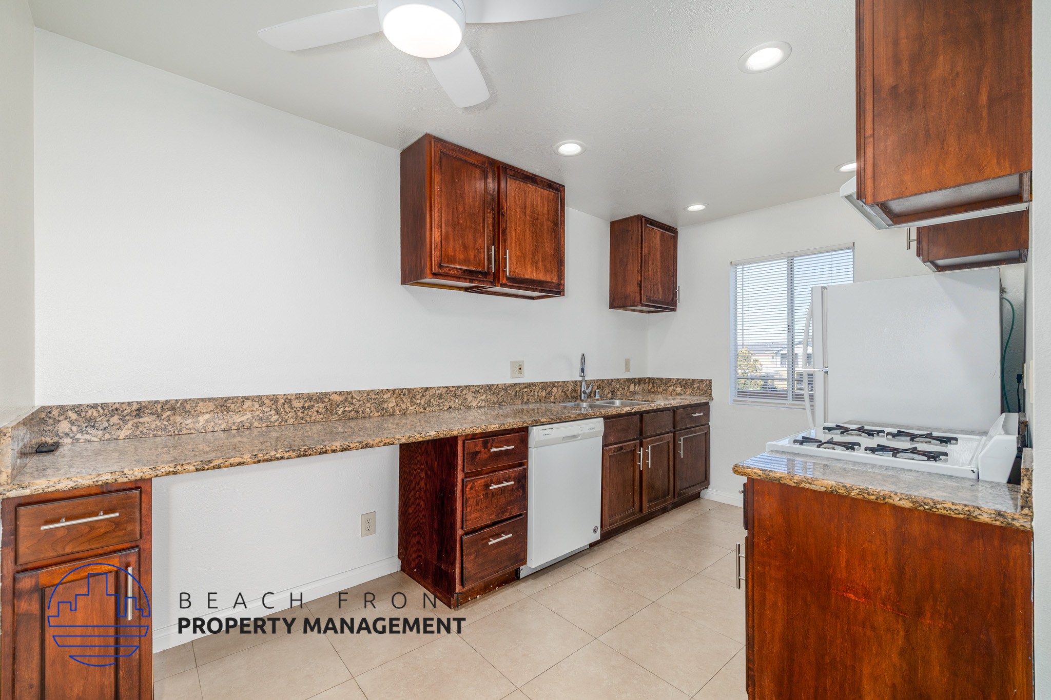 A kitchen with a counter top and cabinets.