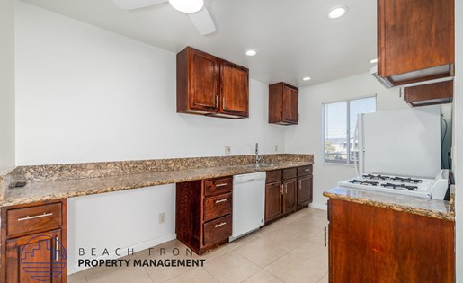A kitchen with a counter top and cabinets.