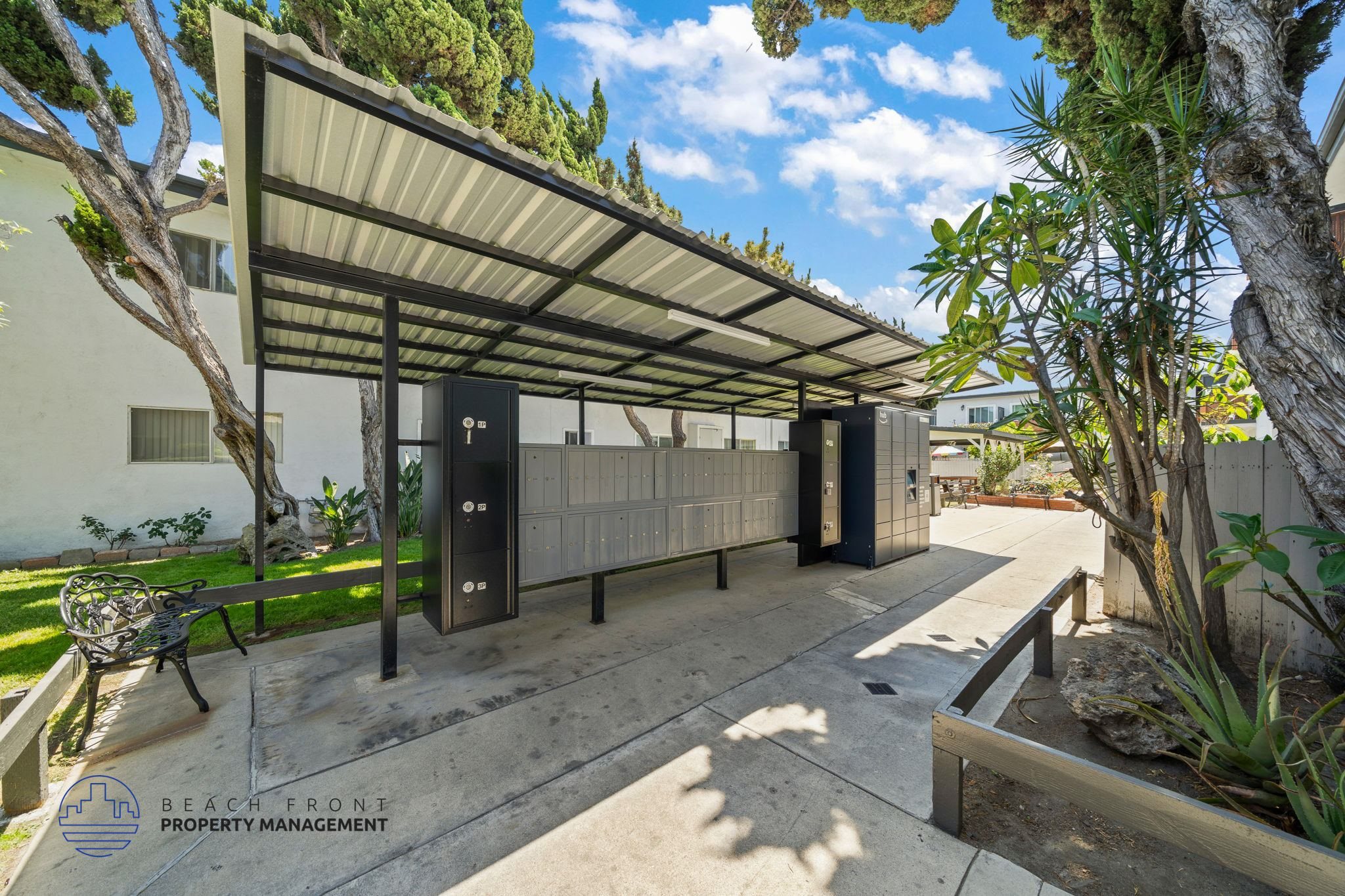 A patio area with a roof and a bench.