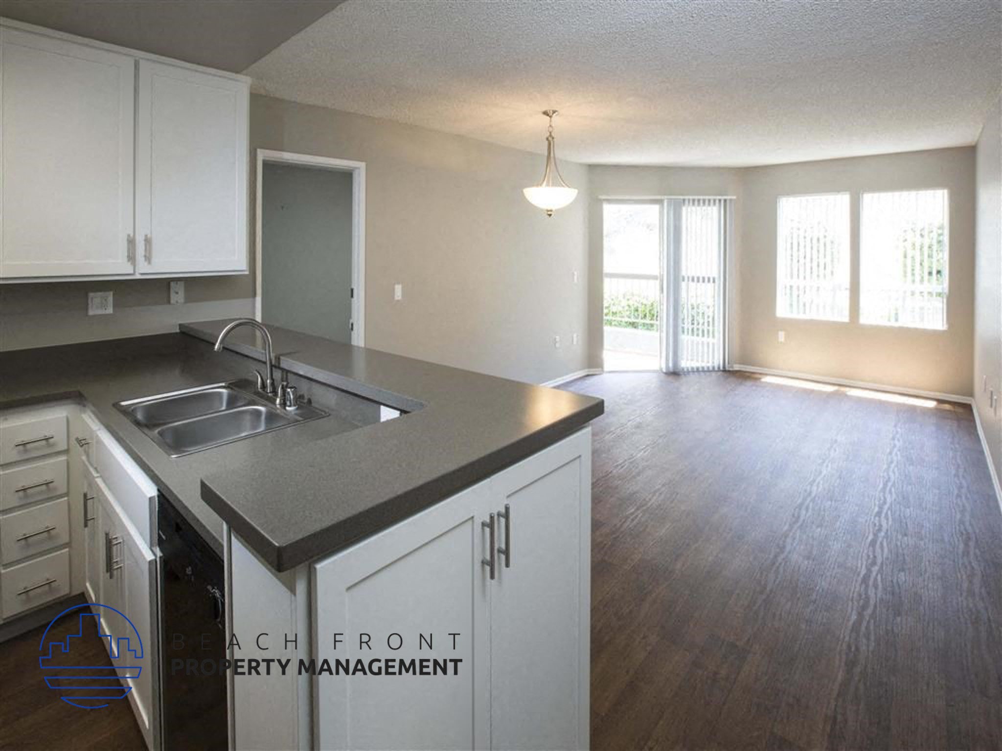 A kitchen with a sink and a window.