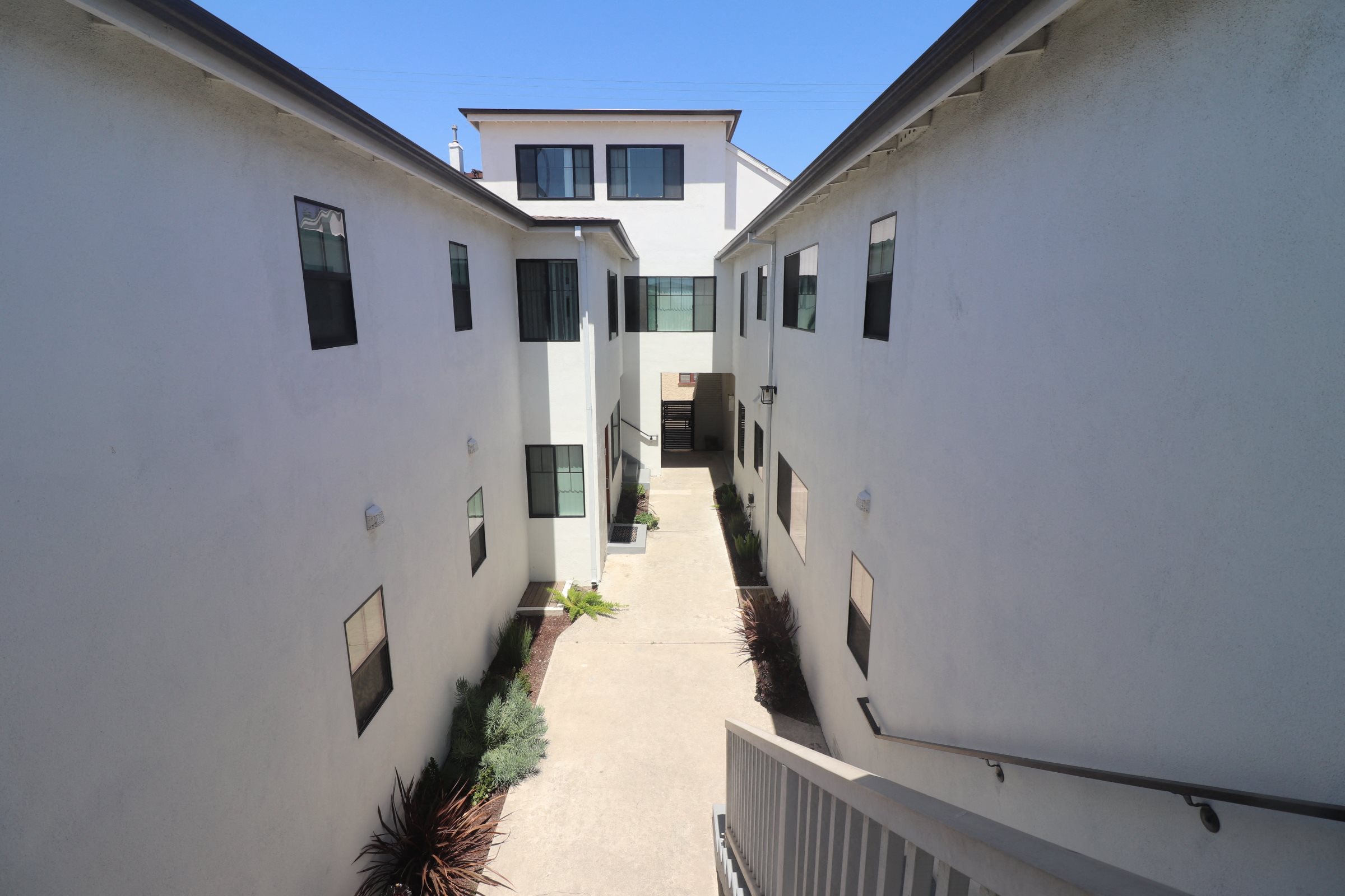 A long white building with a lot of windows.
