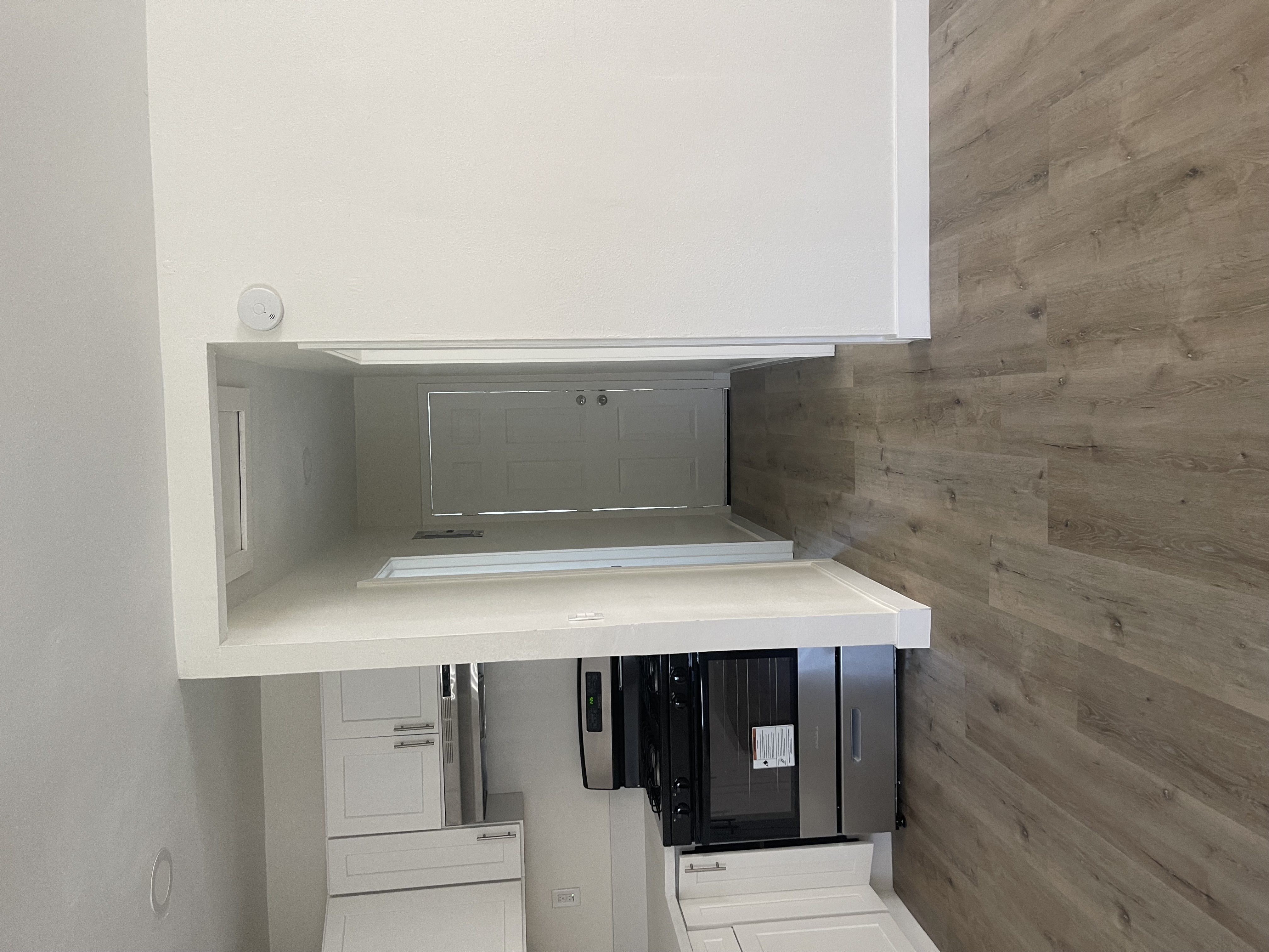 a small kitchen and refrigerator