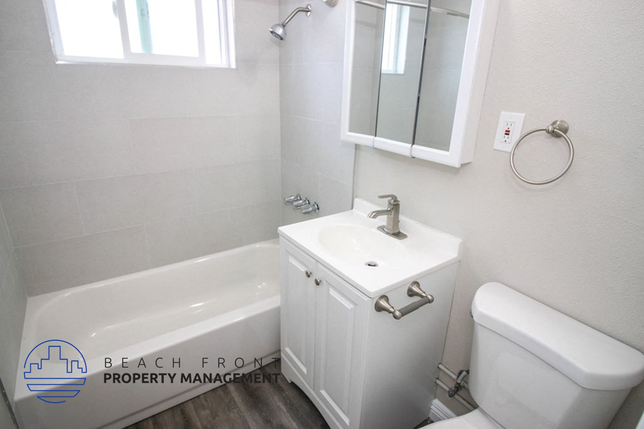 a bathroom with a sink and a toilet and a bath tub