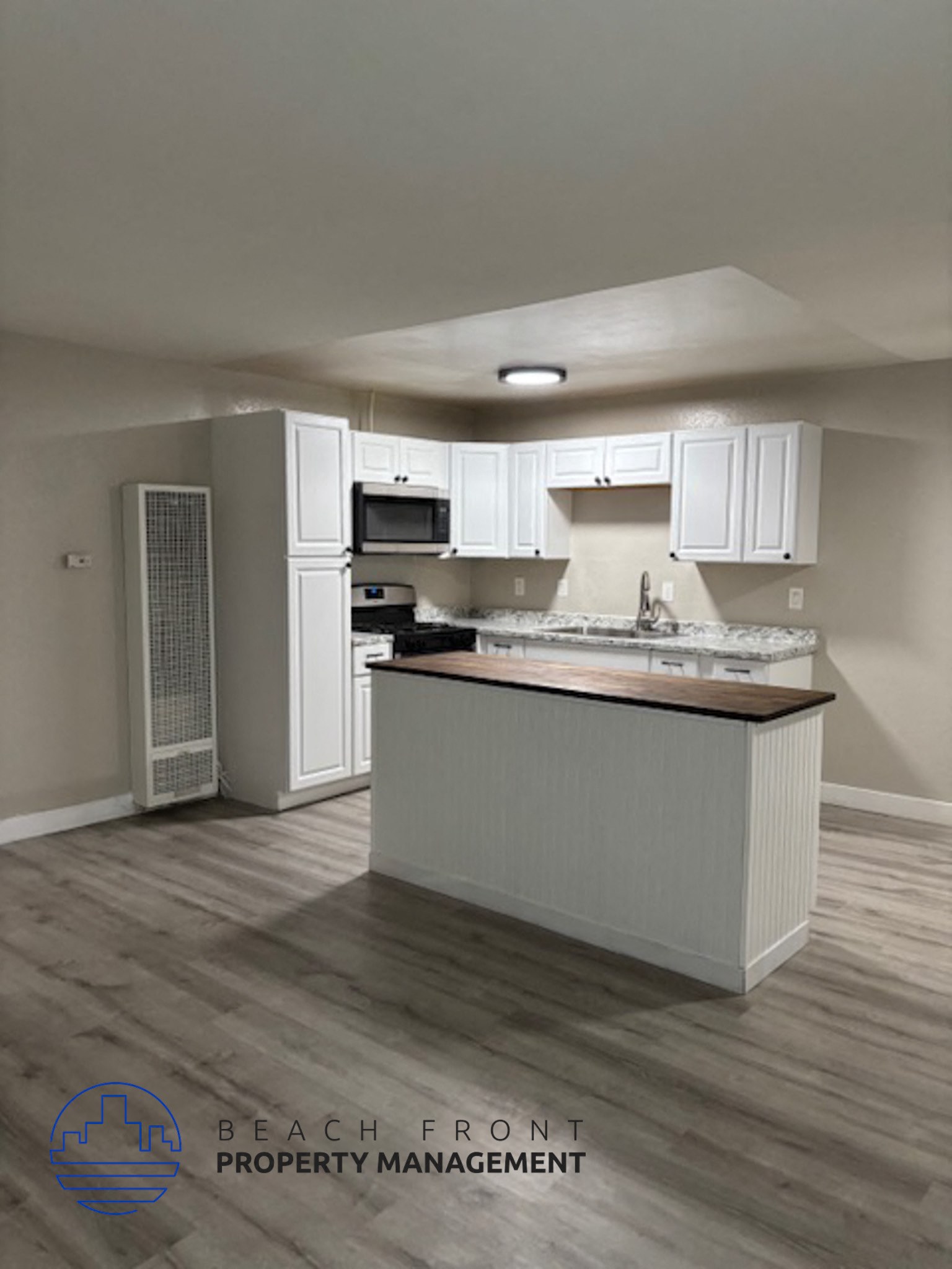 A kitchen with a counter and cabinets.