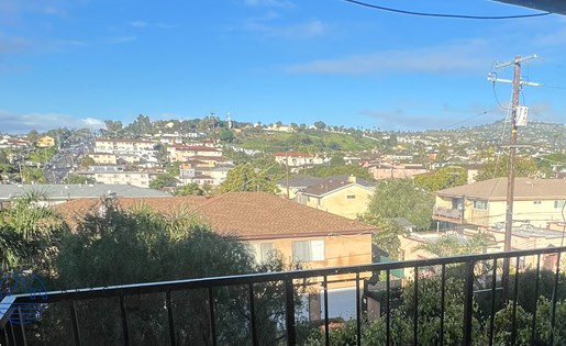 A view of a residential area from a balcony.
