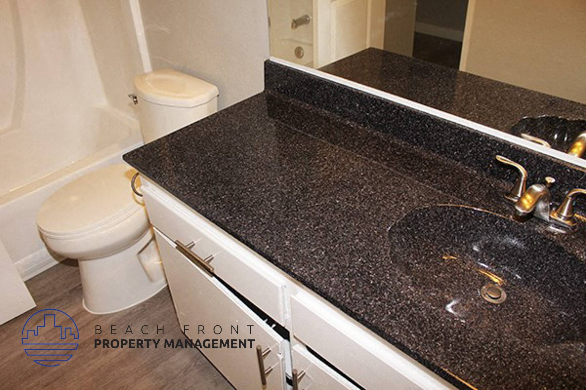 a bathroom with a sink and a toilet,a bathroom with a sink and a toilet