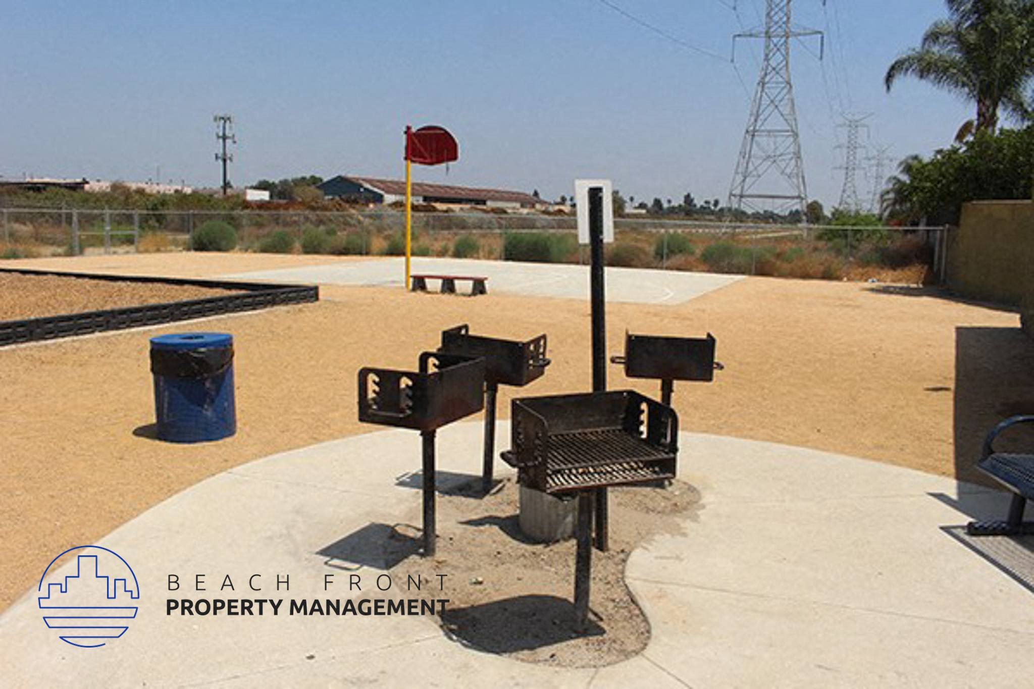 the beach from property management kiosk is in the middle of a sandy area,the beach from property management kiosk is in the middle of a sandy area