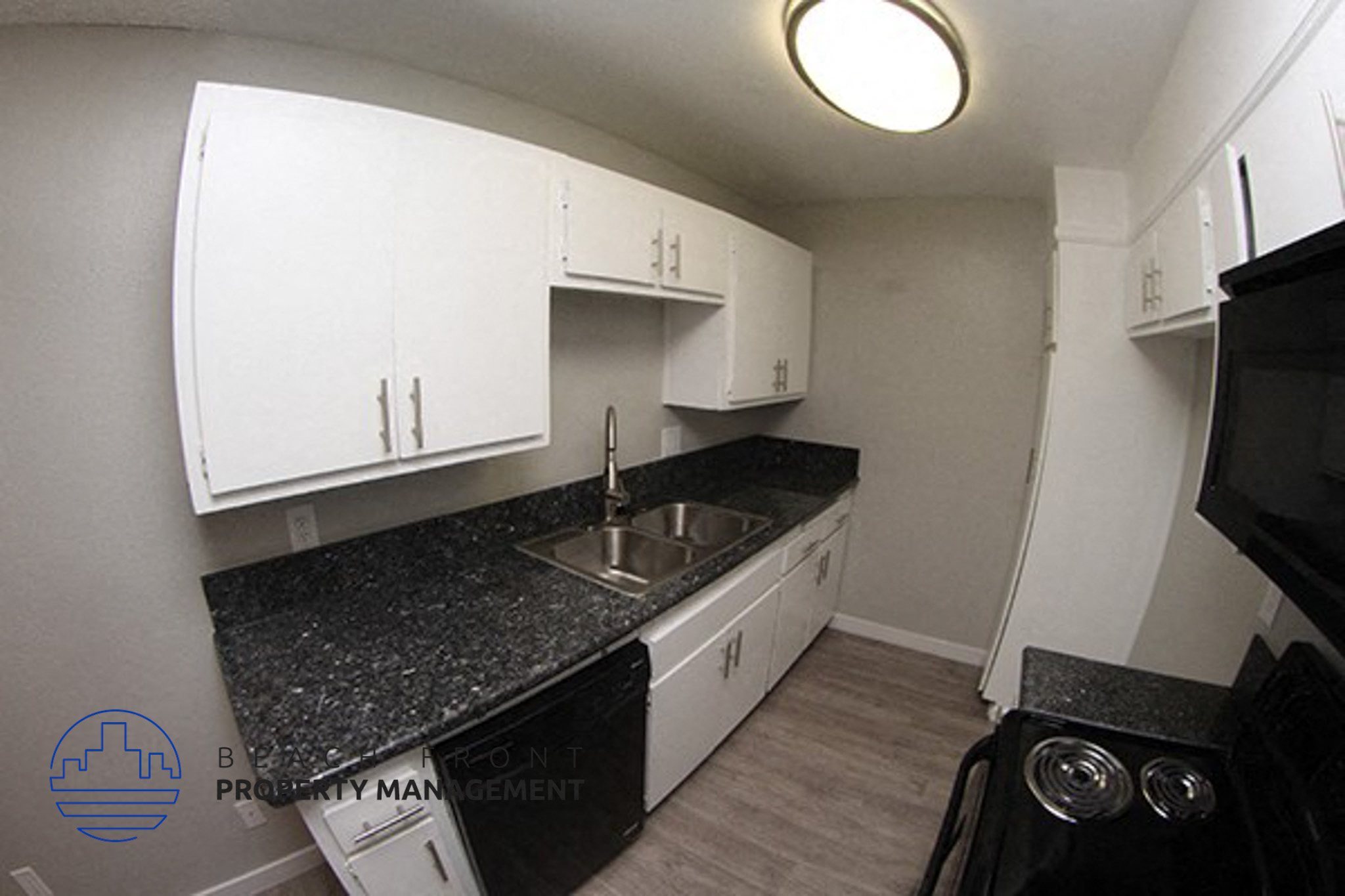 a kitchen with white cabinets and granite counter tops and a sink,a kitchen with white cabinets and granite counter tops and a sink