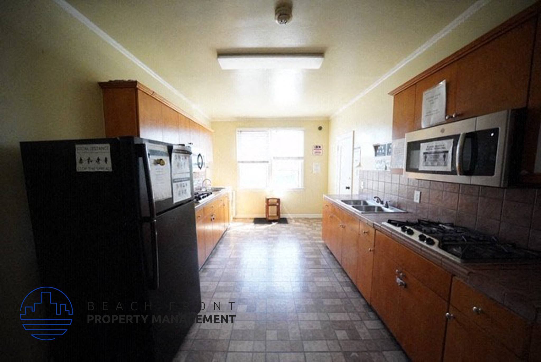 a kitchen with a stove and a refrigerator