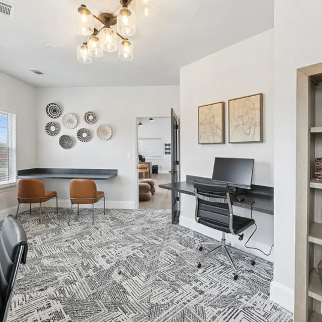 A room with a black and white patterned carpet.