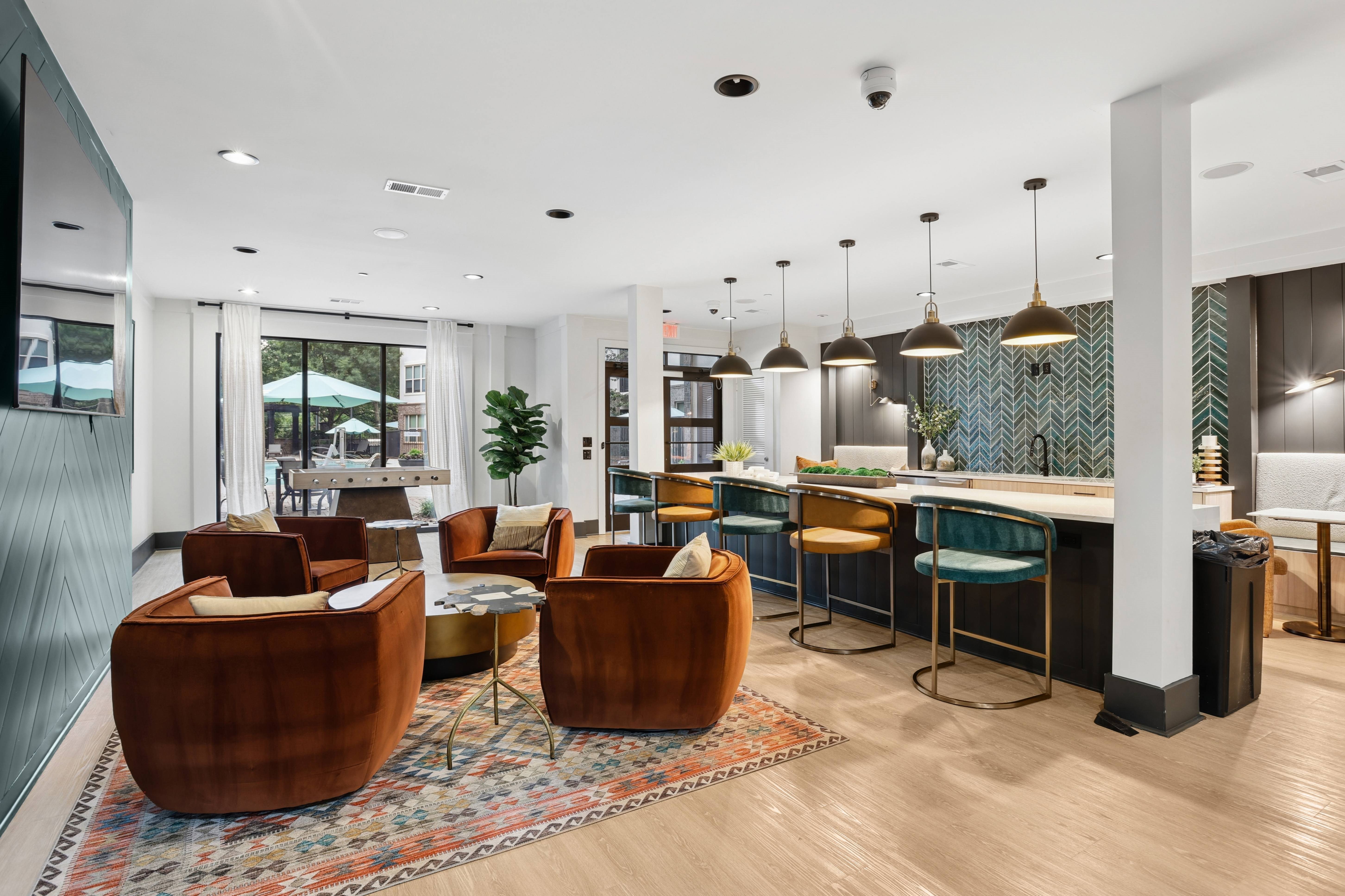 A modern living room with a bar area and comfortable seating.