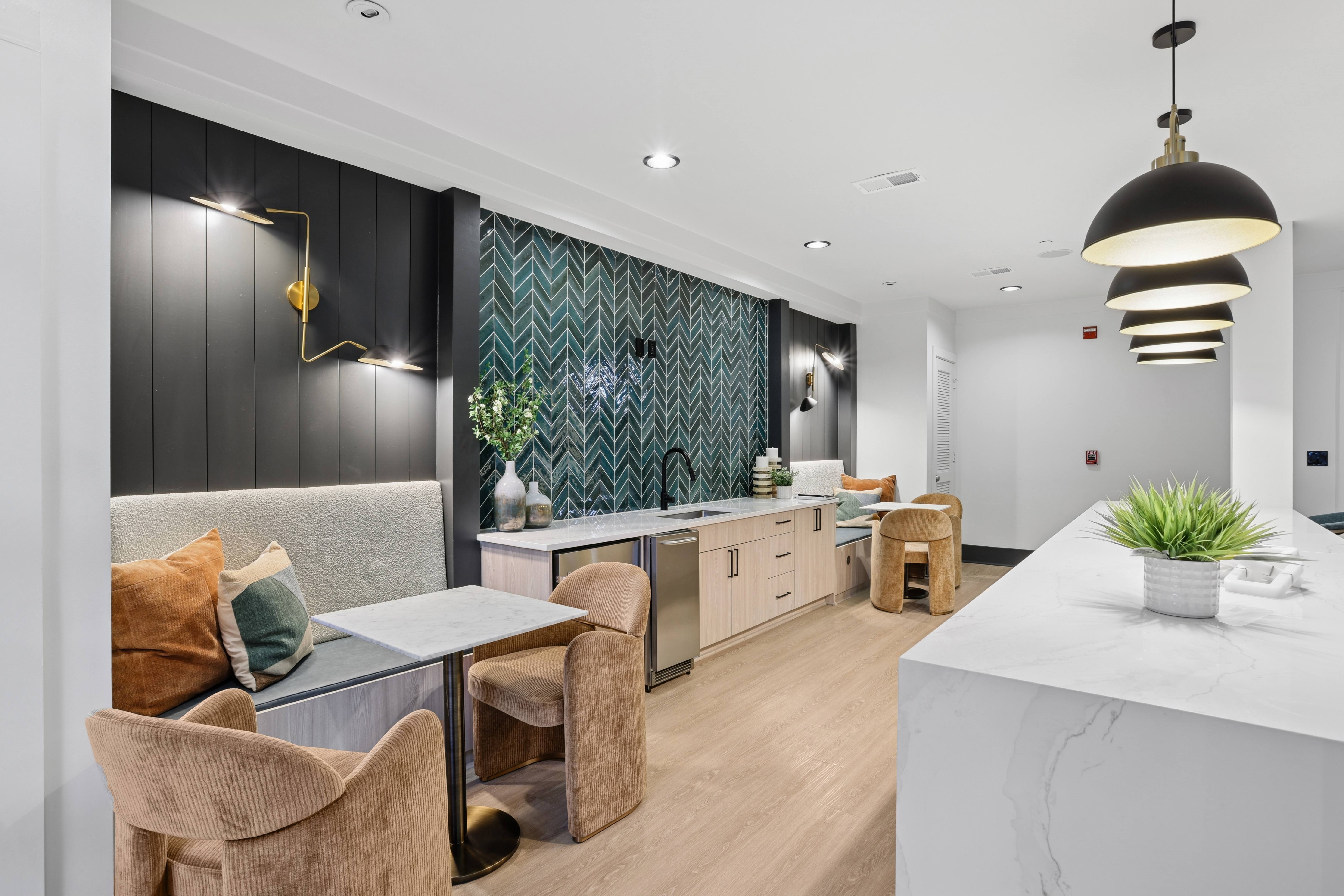 A modern kitchen with a dining table and chairs.