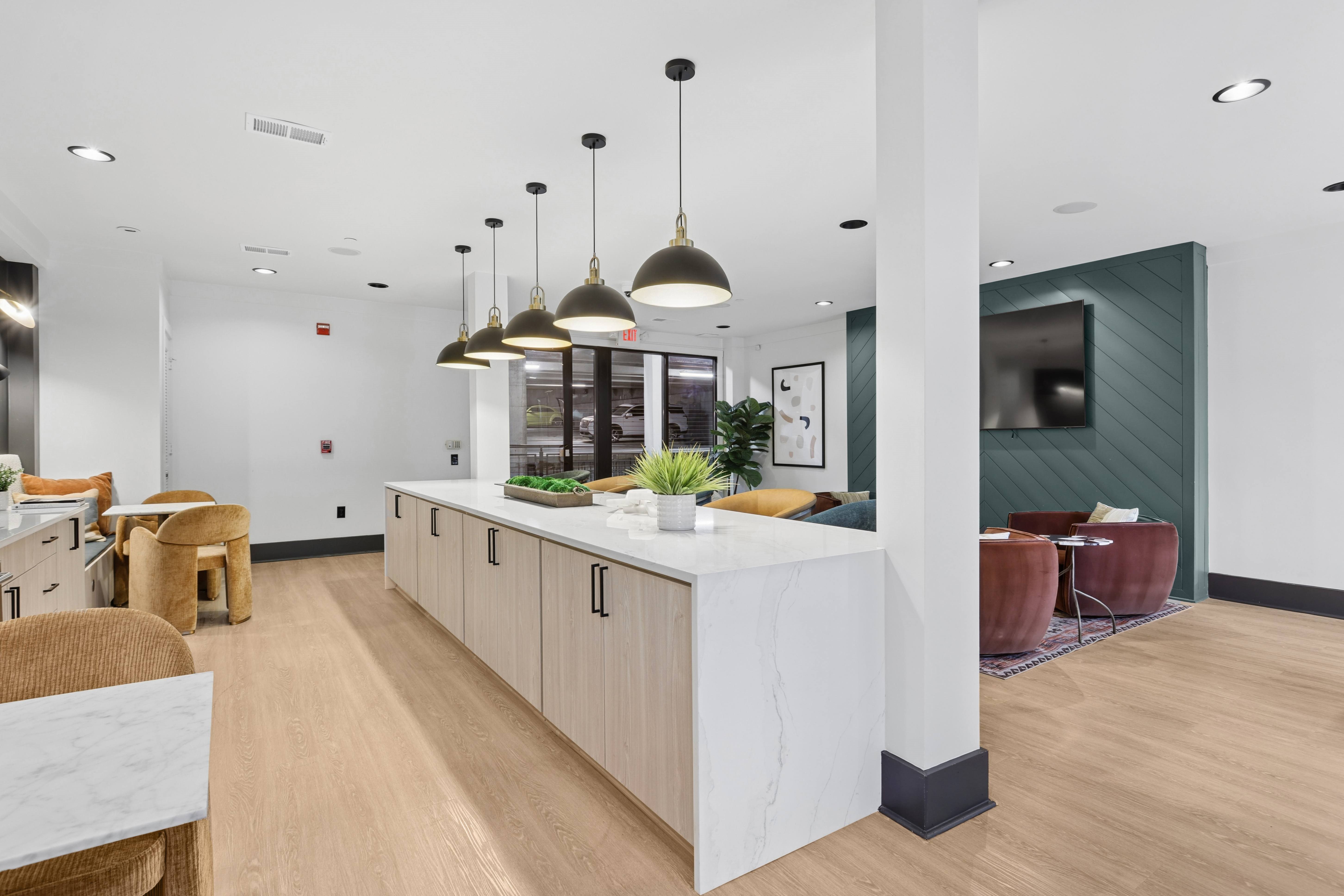 A modern kitchen with a white island and wooden cabinets.