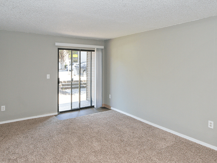 Apartments for Rent Federal Way, WA - Open-Concept Dining Room with Wood Flooring, Ceiling Fan, and Access to Living Room