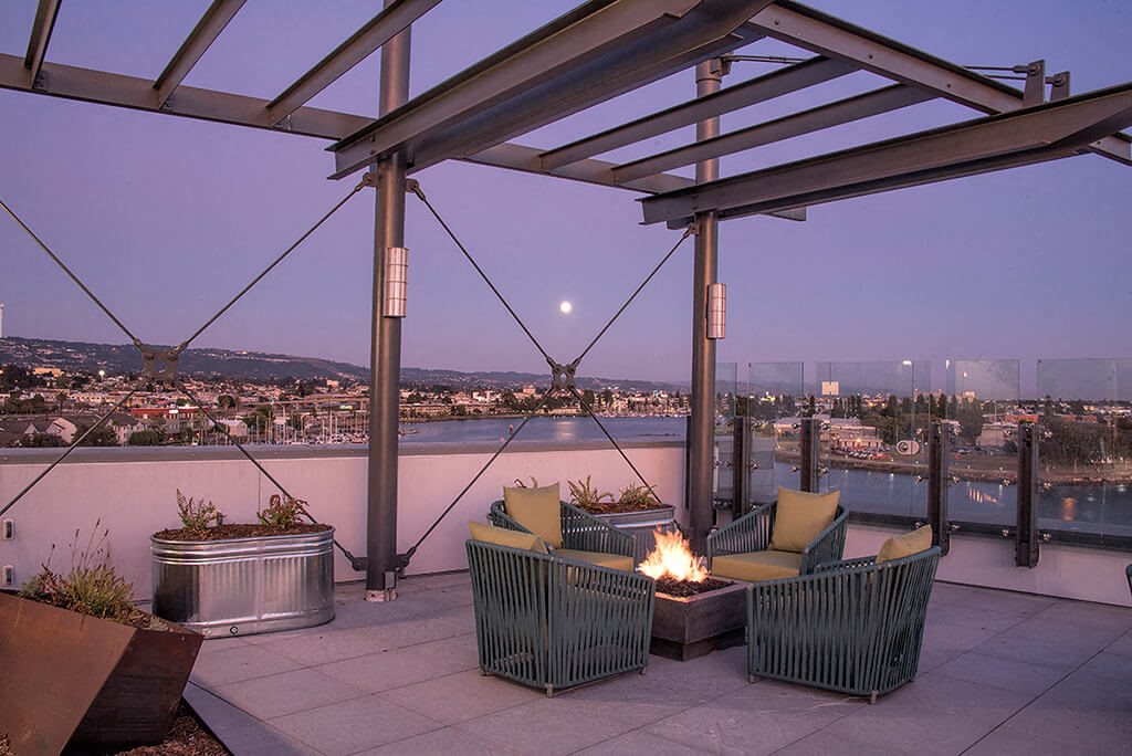 Rooftop seating with firepit  l Orion Apartments in Oakland