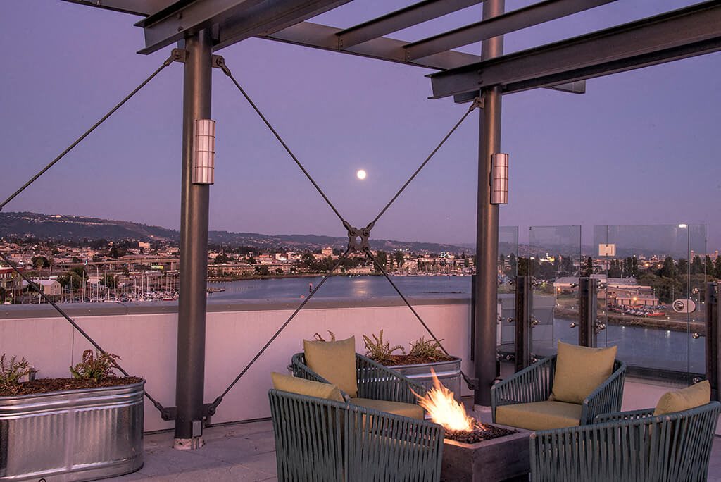 Rooftop seating with firepit  l Orion Apartments in Oakland