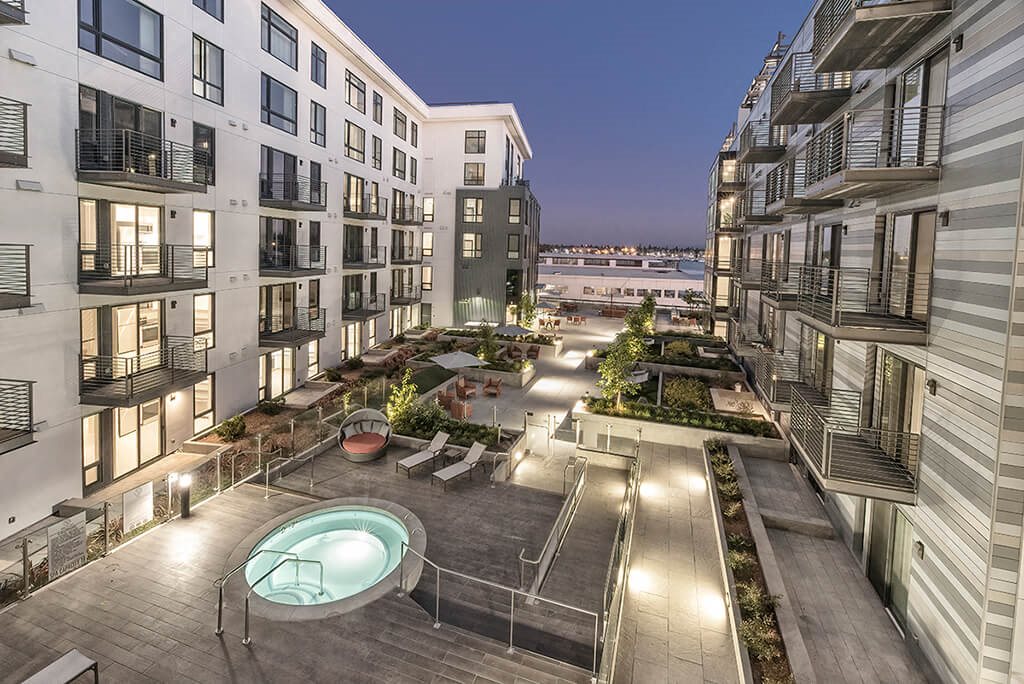 View of spa between buildings l Orion Apartments in Oakland
