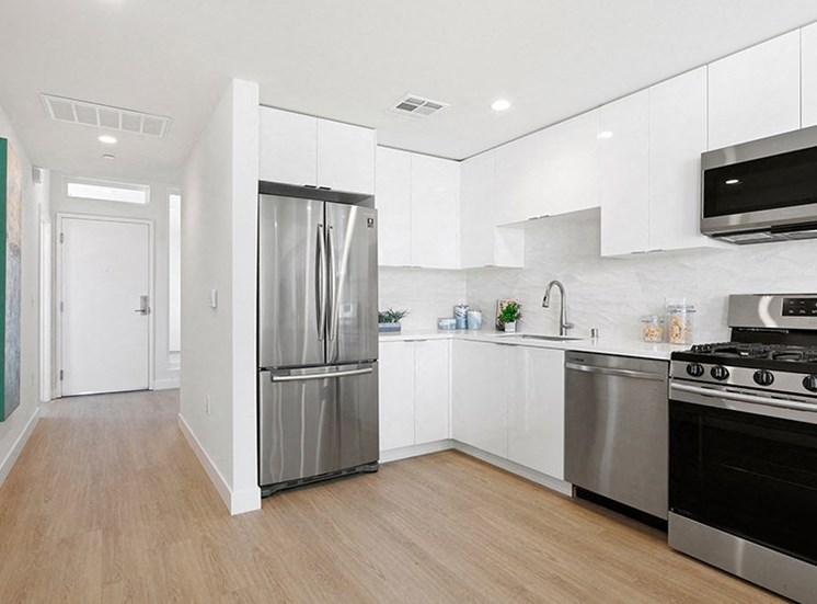 Kitchen with stainless steel appliances and wood flooring