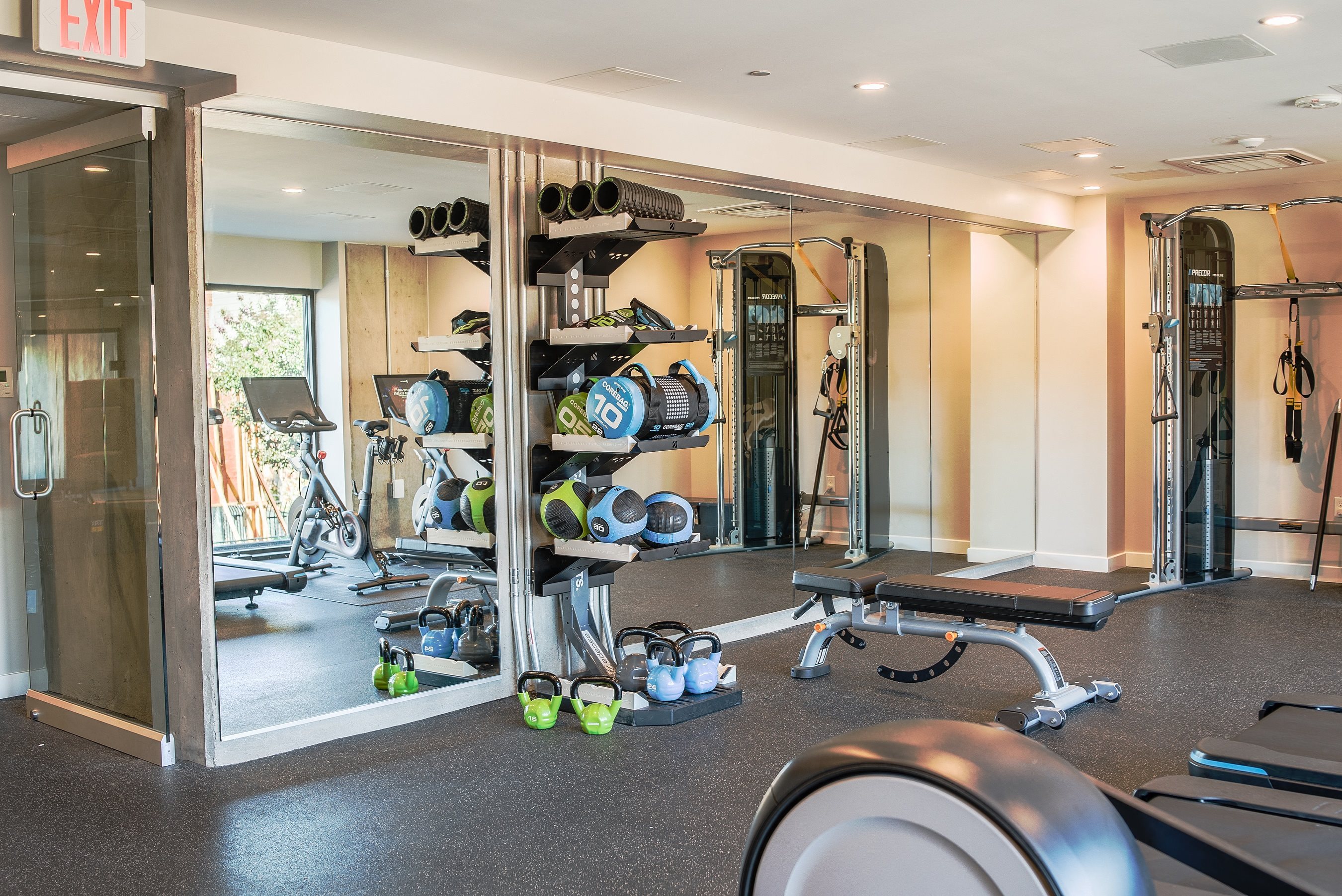 Gym with cardio and weight equipment l Rasa Apartments in Oakland CA