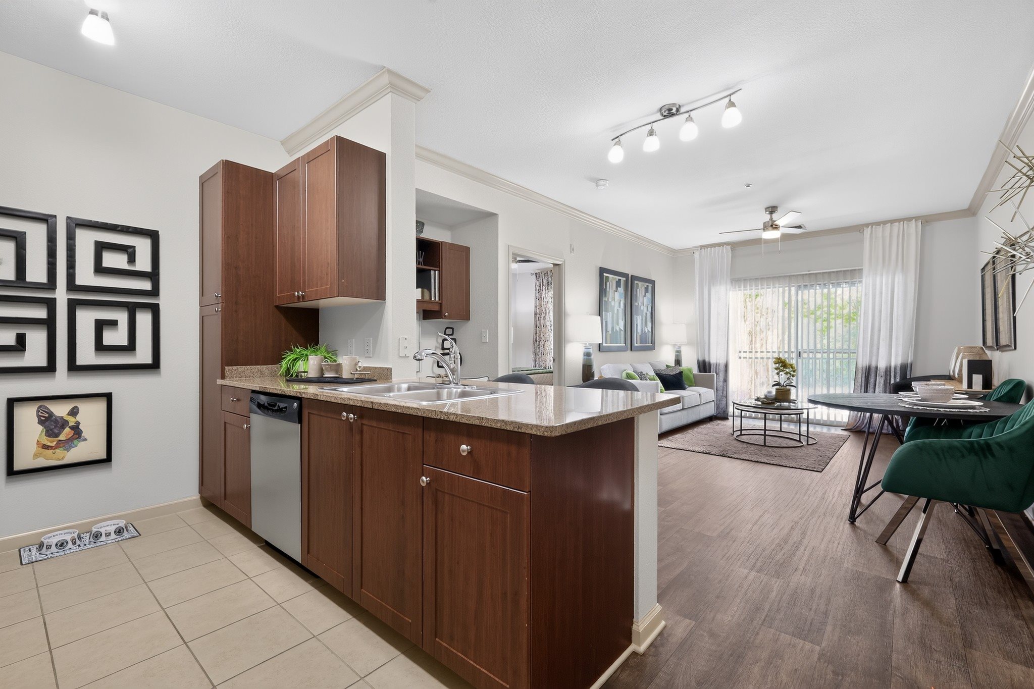 A kitchen with brown cabinets and a white countertop.