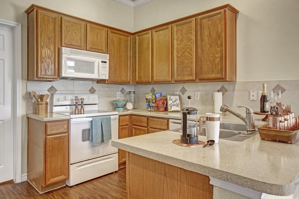 San Antonio TX Apartments for Rent - The Anthony at Canyon Springs Upgraded Kitchen with Plenty of Counter Space, White Appliances, and Much More