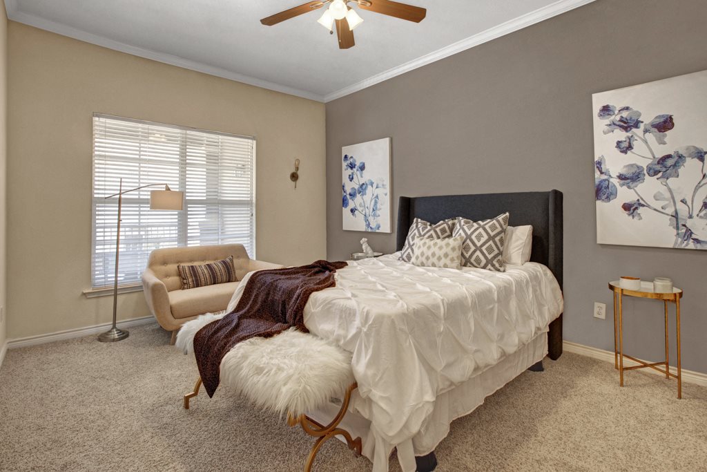 Apartments in San Antonio TX - The Anthony at Canyon Springs Spacious Bedroom with a Large Window, Lush Carpeting, and Much More