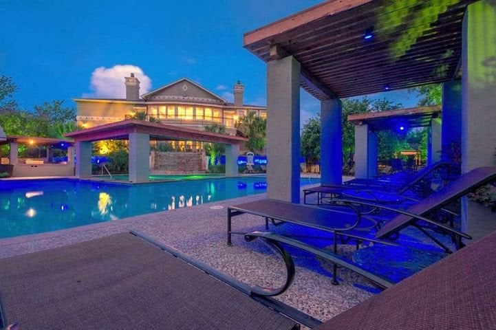 Apartments San Antonio TX - The Anthony at Canyon Springs Relaxing Pool with Lounge Chairs, Waterfall, Spa, and More