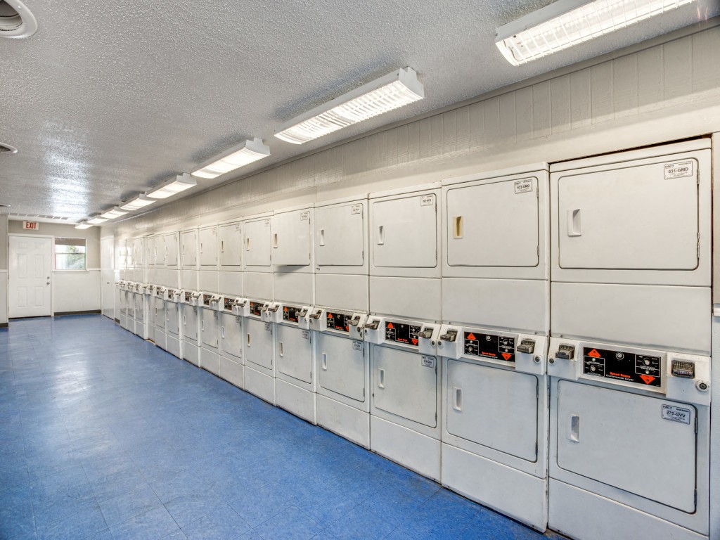Convenient laundry facility with modern washers at Monarch Pass Fort Worth TX