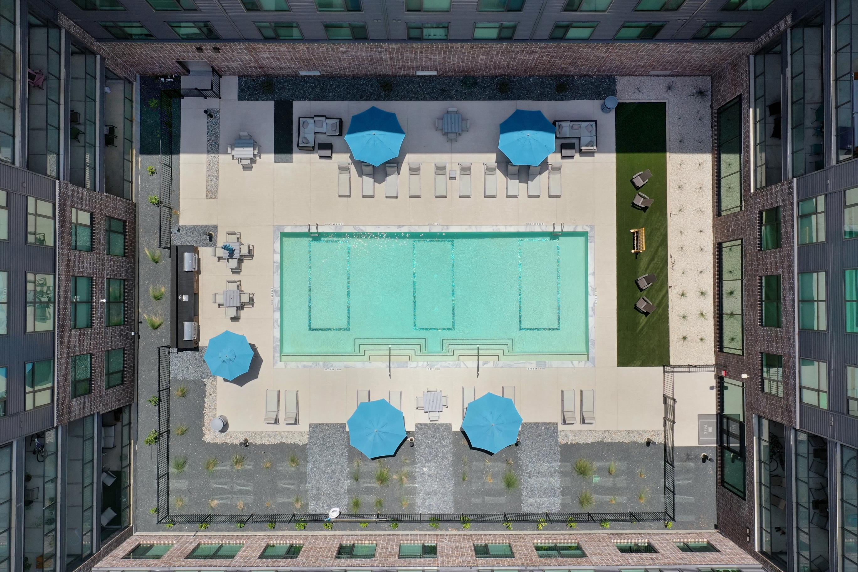 Aerial drone view of 100 Park pool and outdoor amenities at Century Square