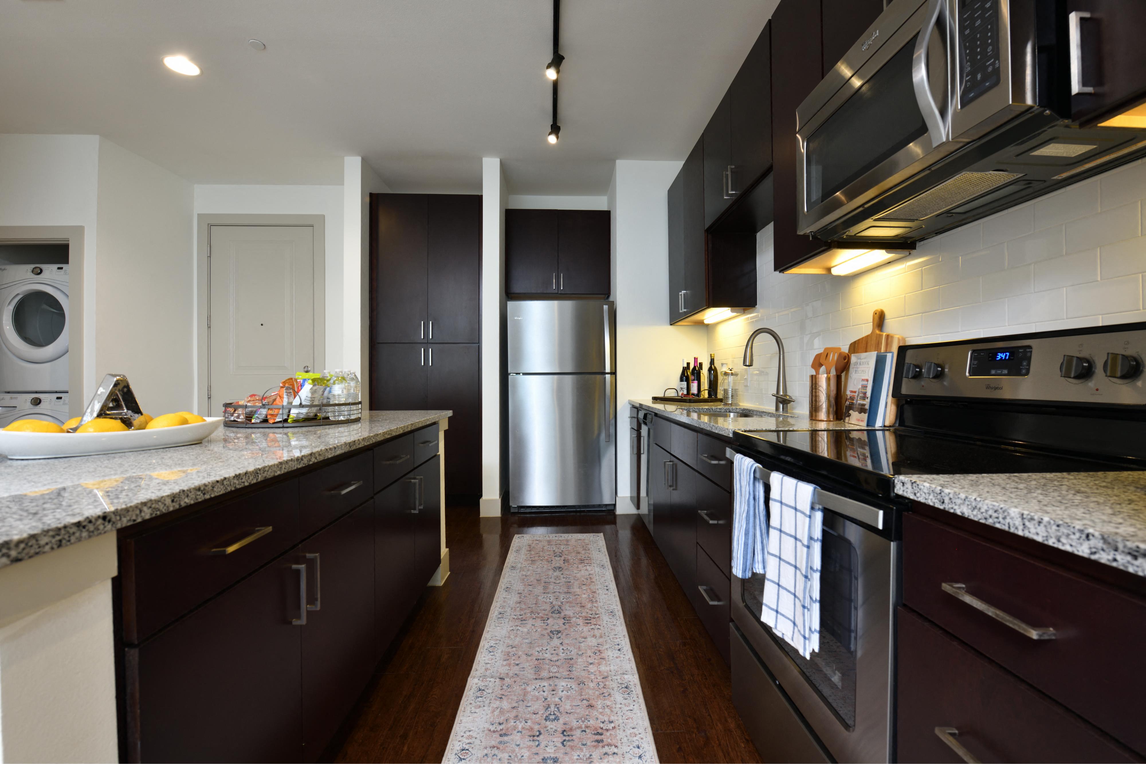 Kitchen interior at 100 Park  premium appliances, modern cabinetry, open layout