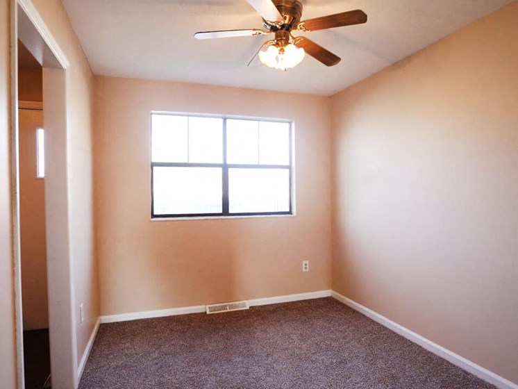Apartment Bedroom with Ceiling Fan