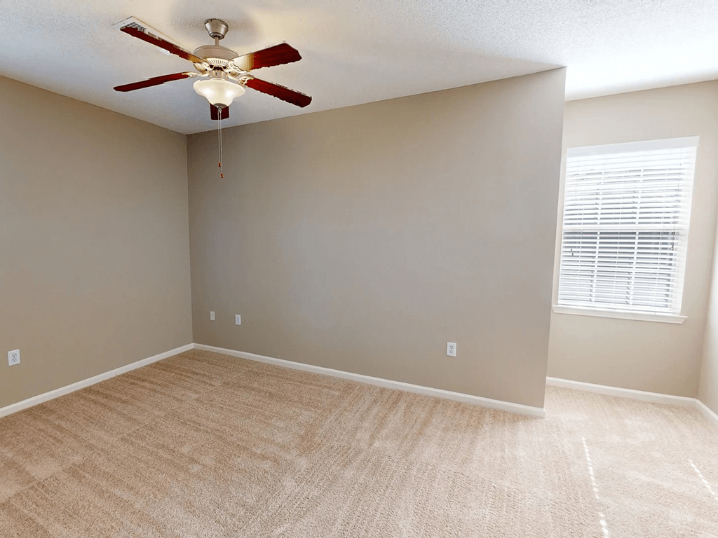 apartment bedroom with ceiling fan
