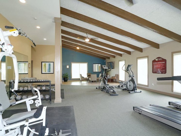 Fitness center at The Oaks at Prairie View Apartments